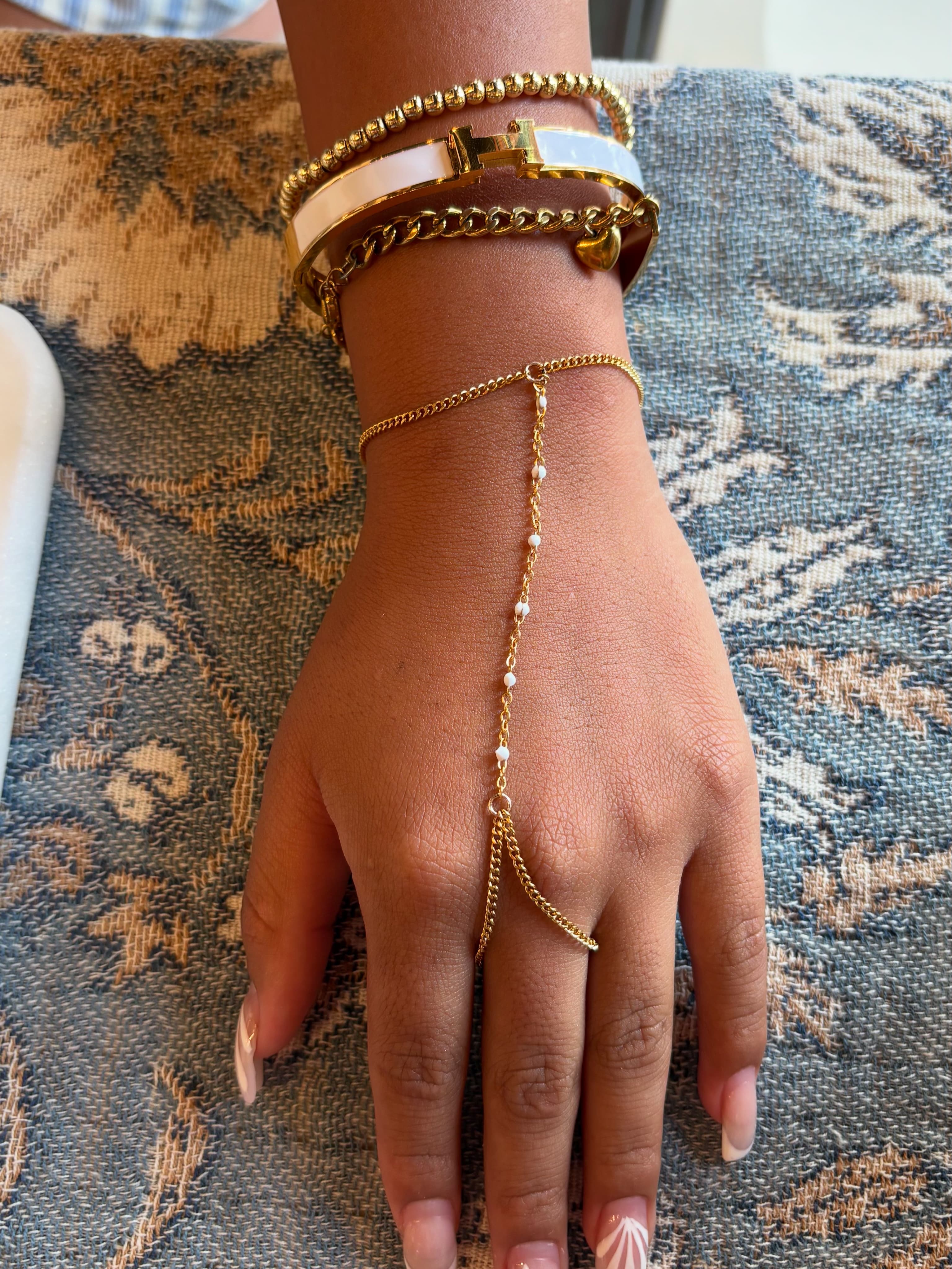 Hand chain on blue floral fabric